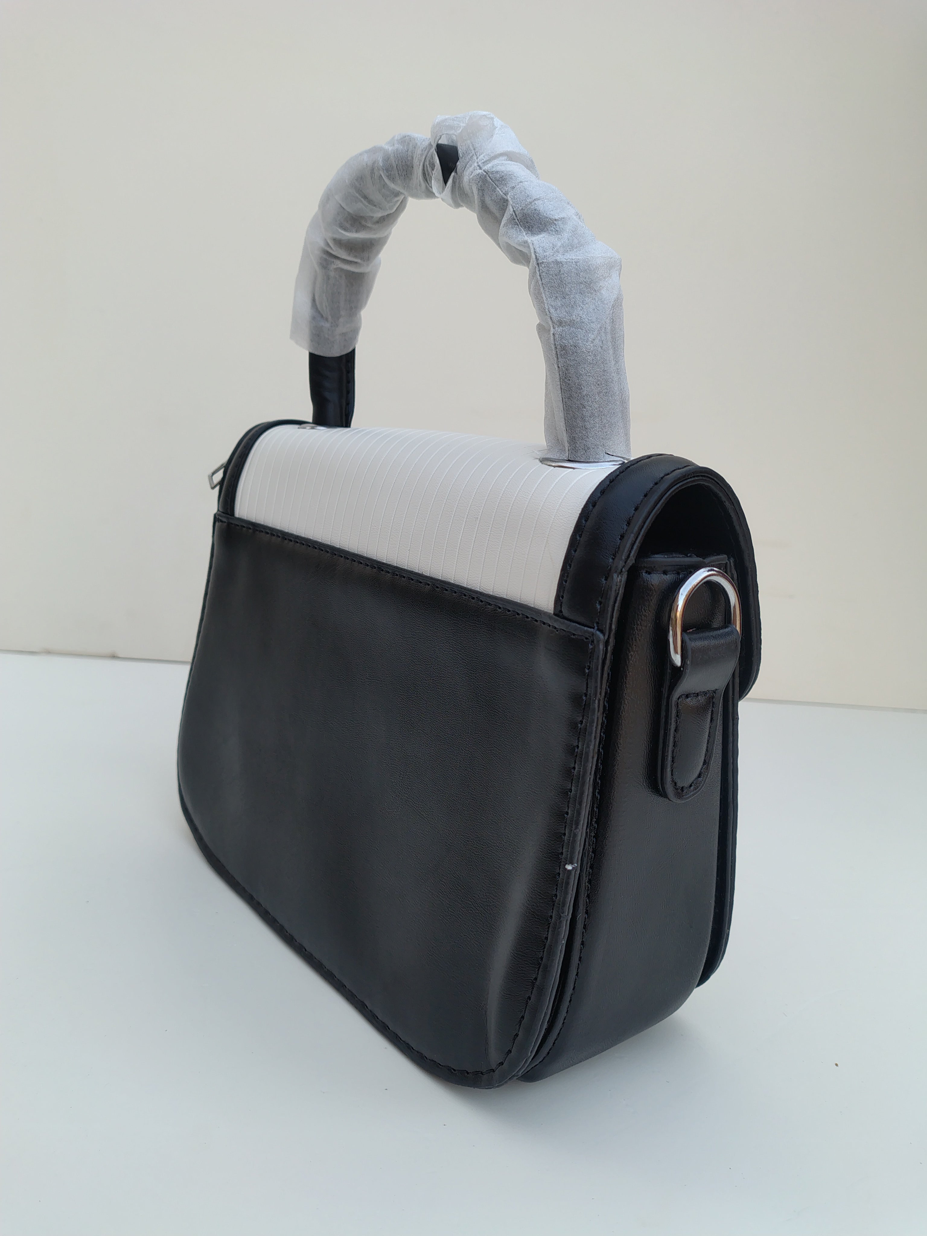 White & Black Structured “D” Handbag – Asymmetric Flap Design