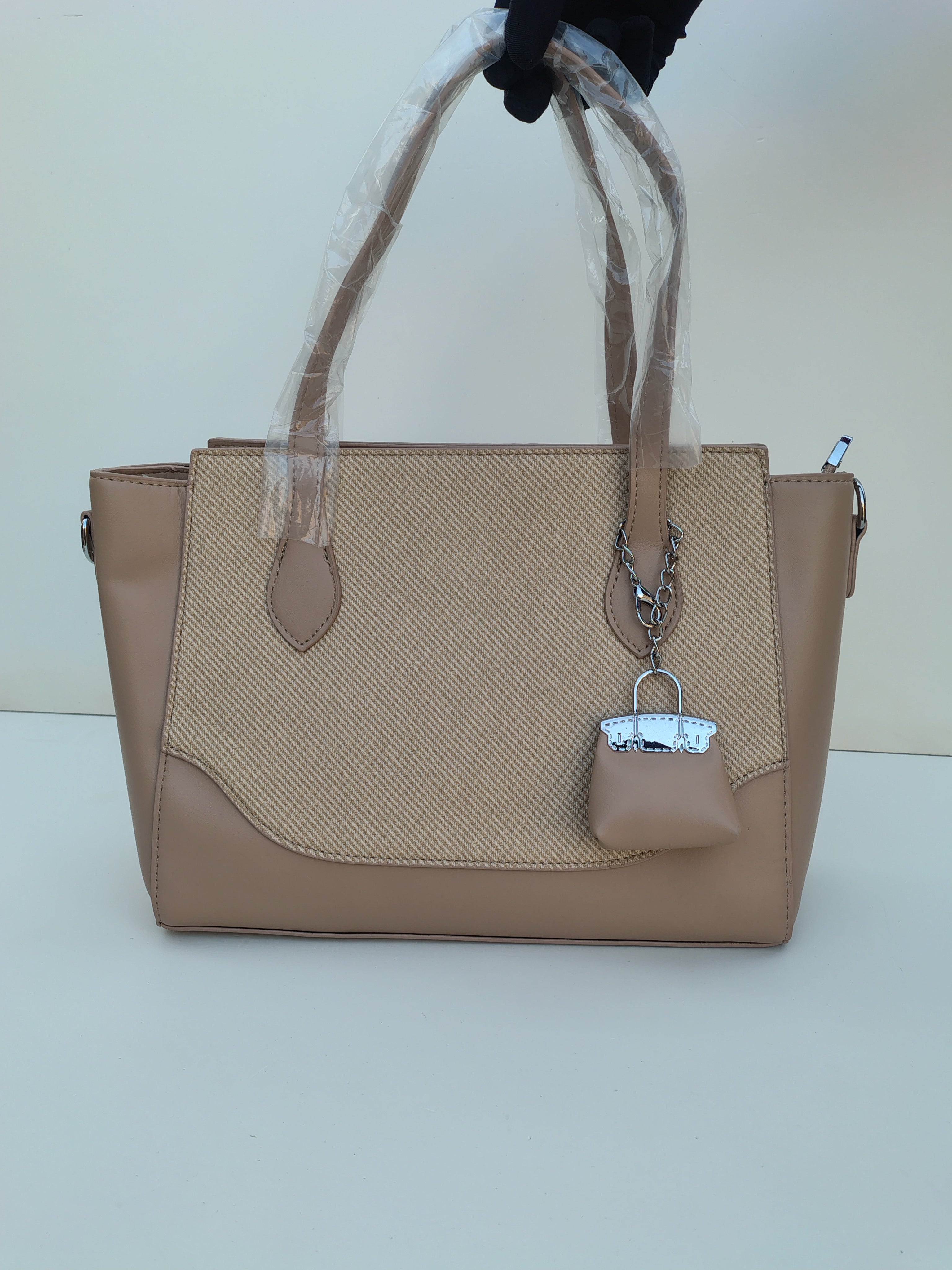 Beige Textured Tote Bag with Mini Charm – Elegant Neutral Handbag
