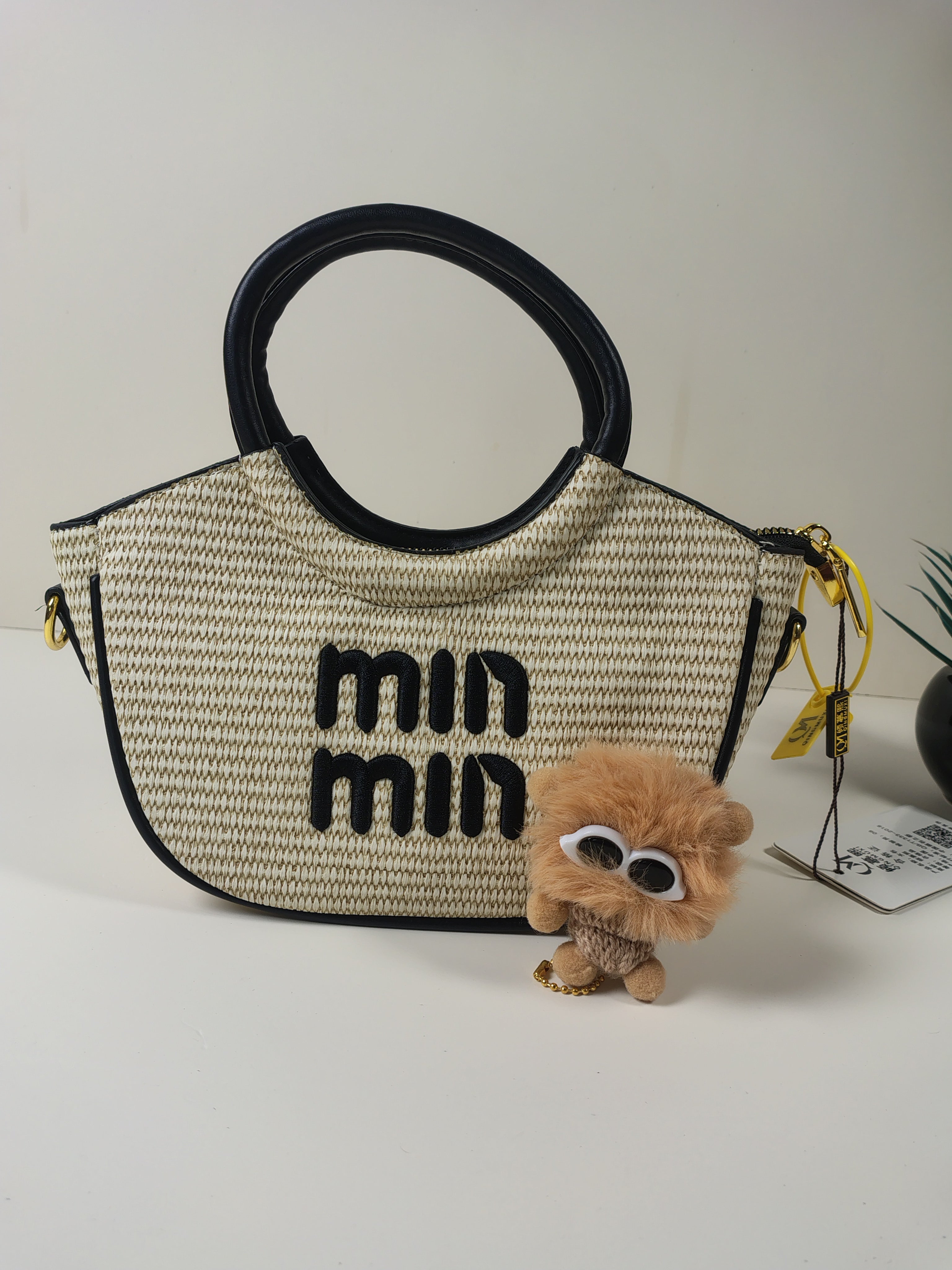 Min Min Woven Handbag with Plush Charm – Beige & Black