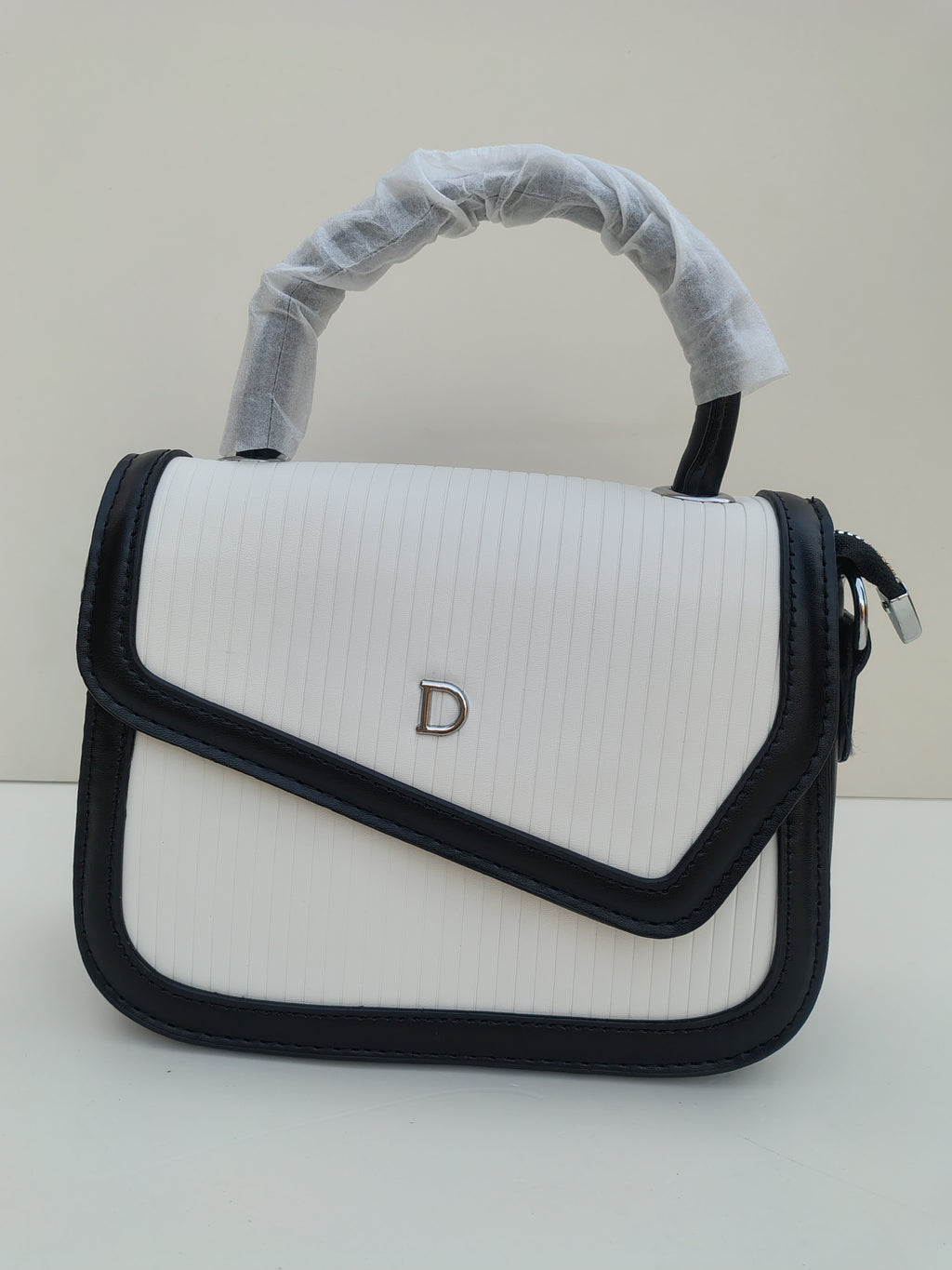 White & Black Structured “D” Handbag – Asymmetric Flap Design
