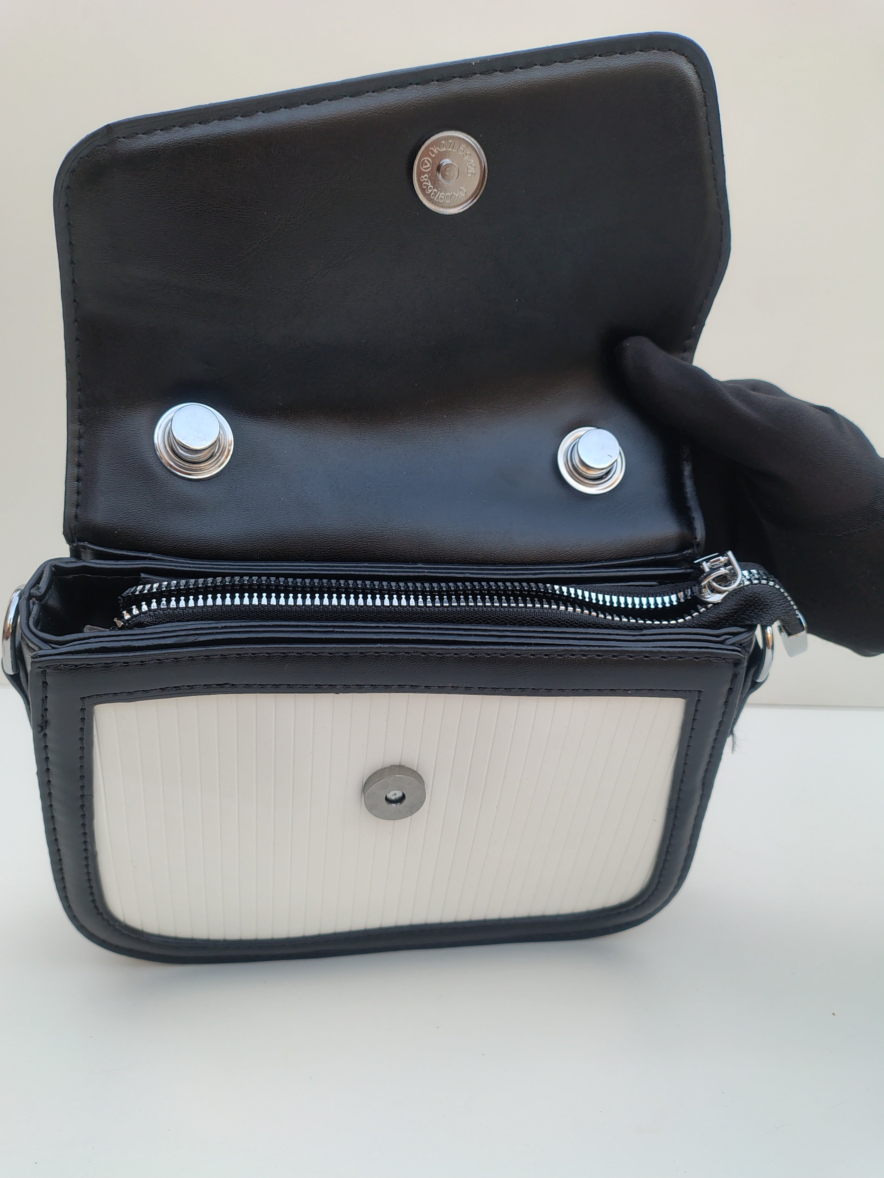 White & Black Structured “D” Handbag – Asymmetric Flap Design