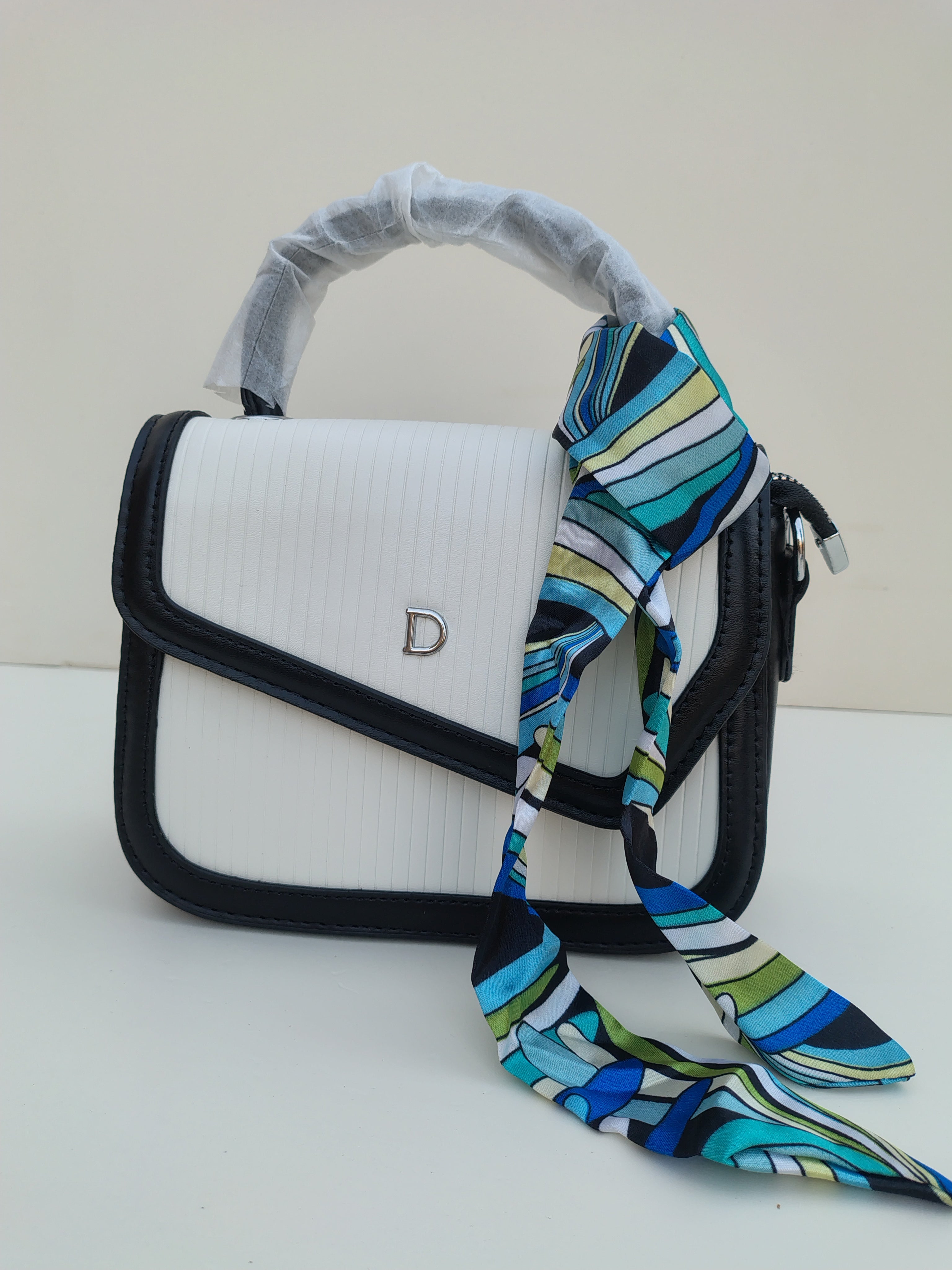 White & Black Structured “D” Handbag – Asymmetric Flap Design