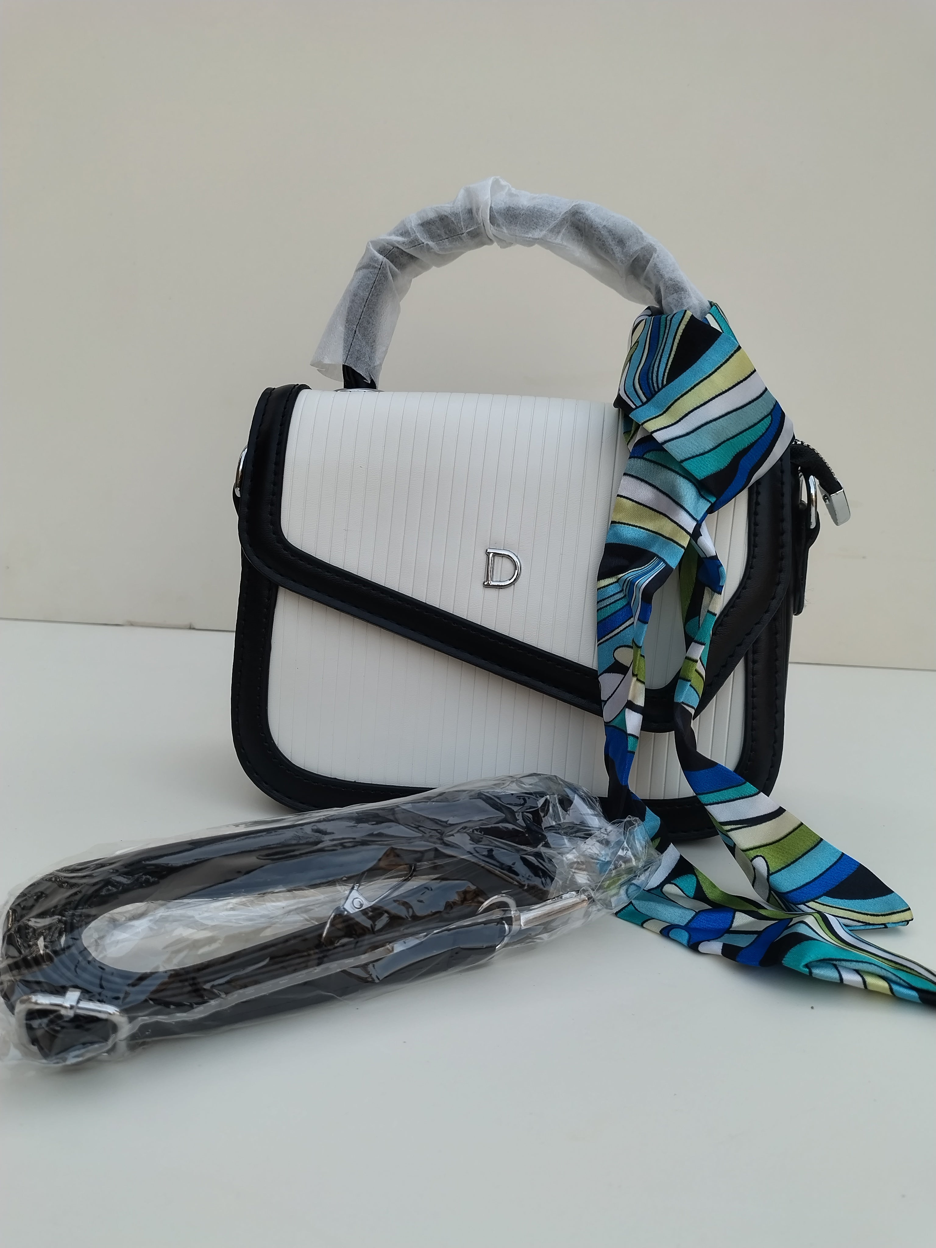 White & Black Structured “D” Handbag – Asymmetric Flap Design