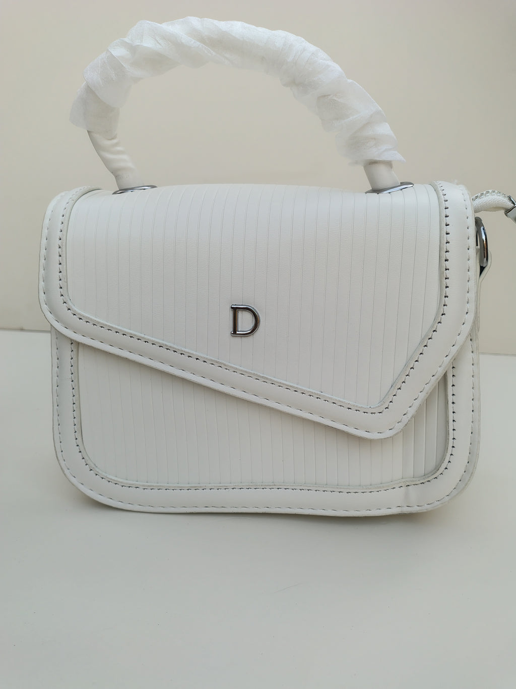 Classic White “D” Handbag – Minimalist Asymmetric Flap Design