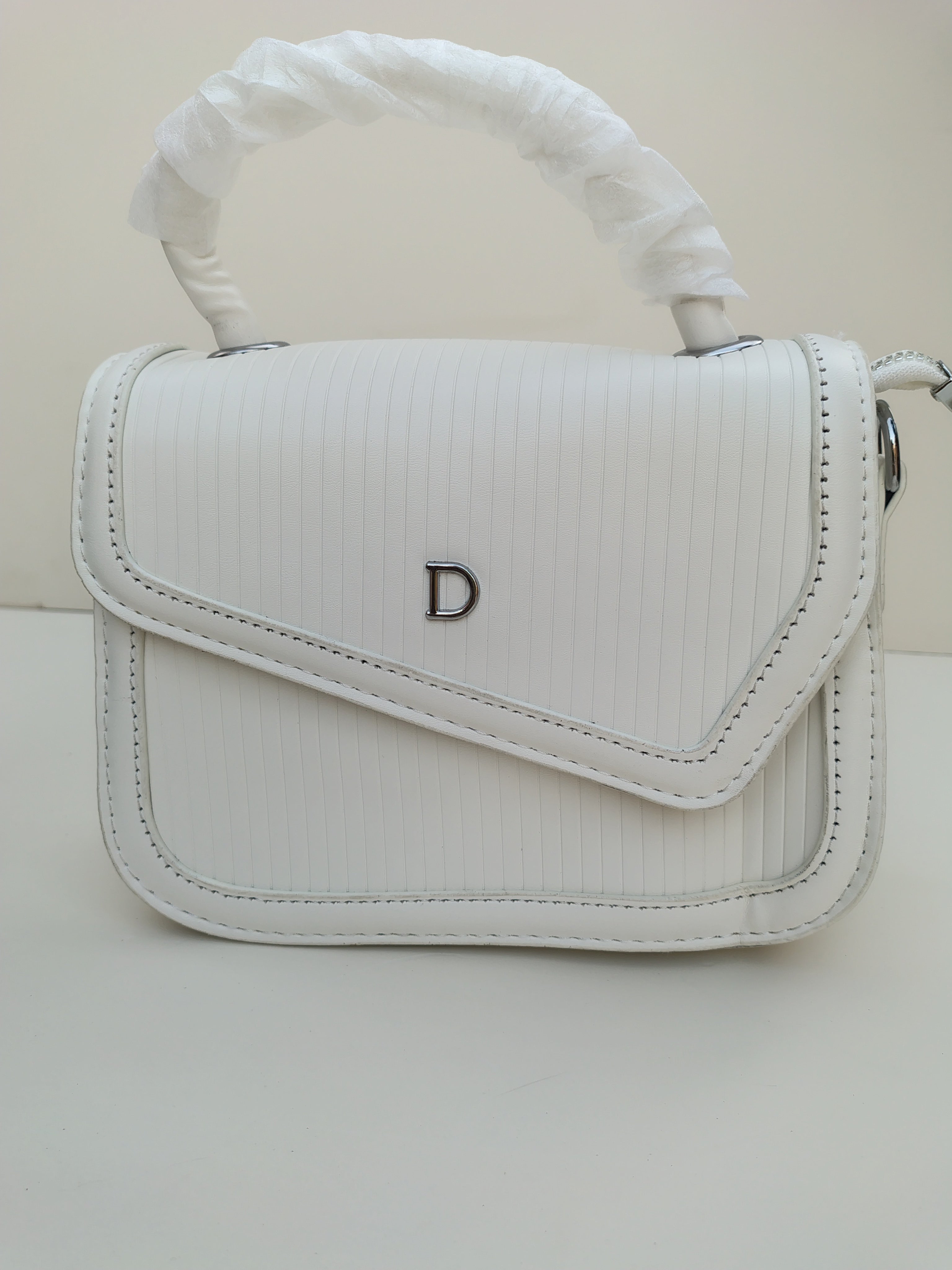 Classic White “D” Handbag – Minimalist Asymmetric Flap Design