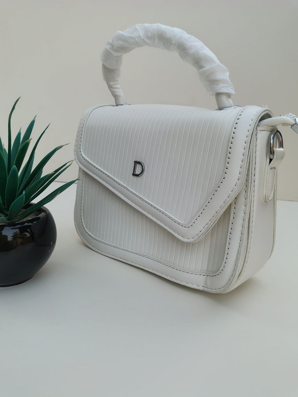 Classic White “D” Handbag – Minimalist Asymmetric Flap Design