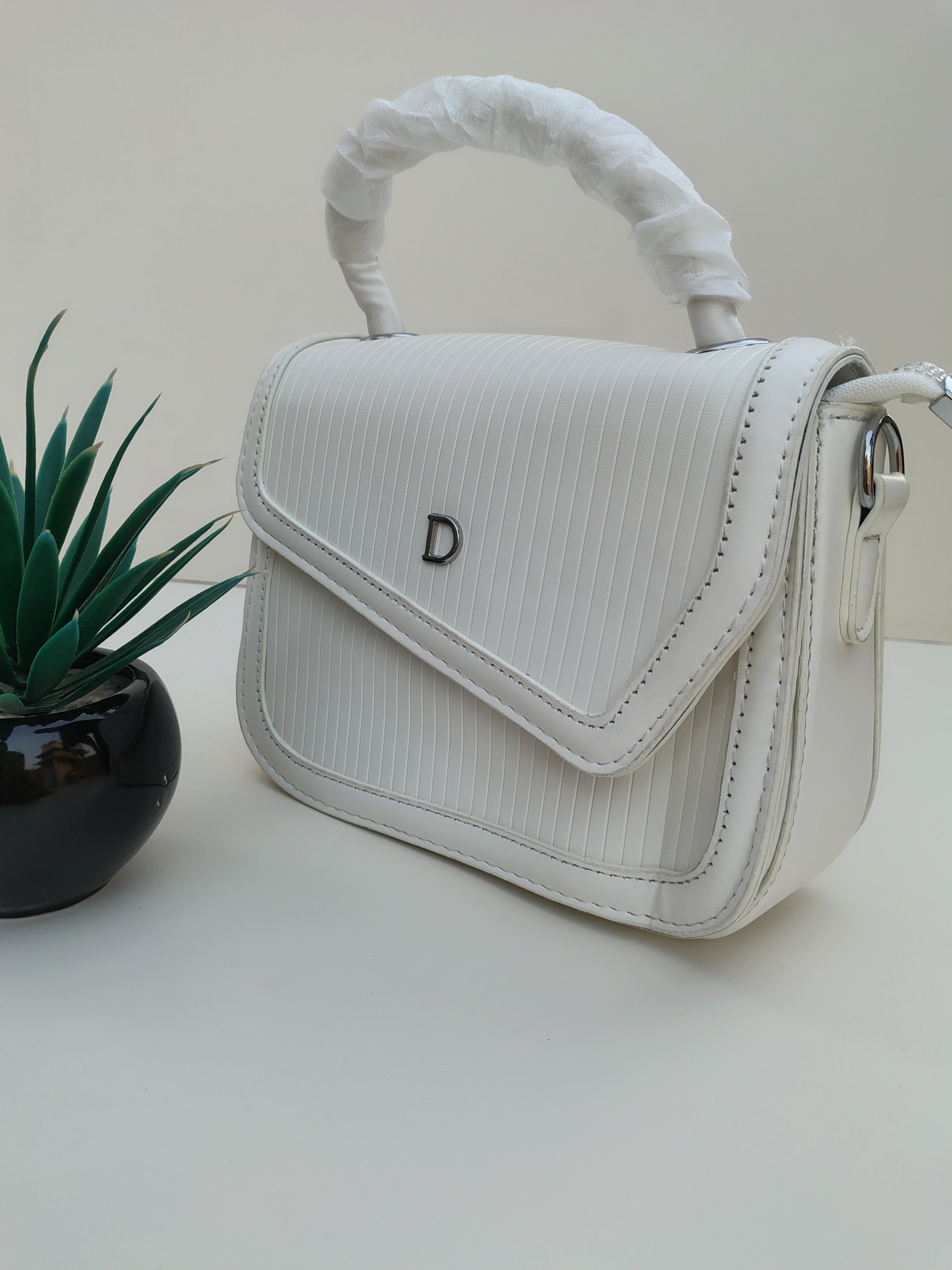 Classic White “D” Handbag – Minimalist Asymmetric Flap Design