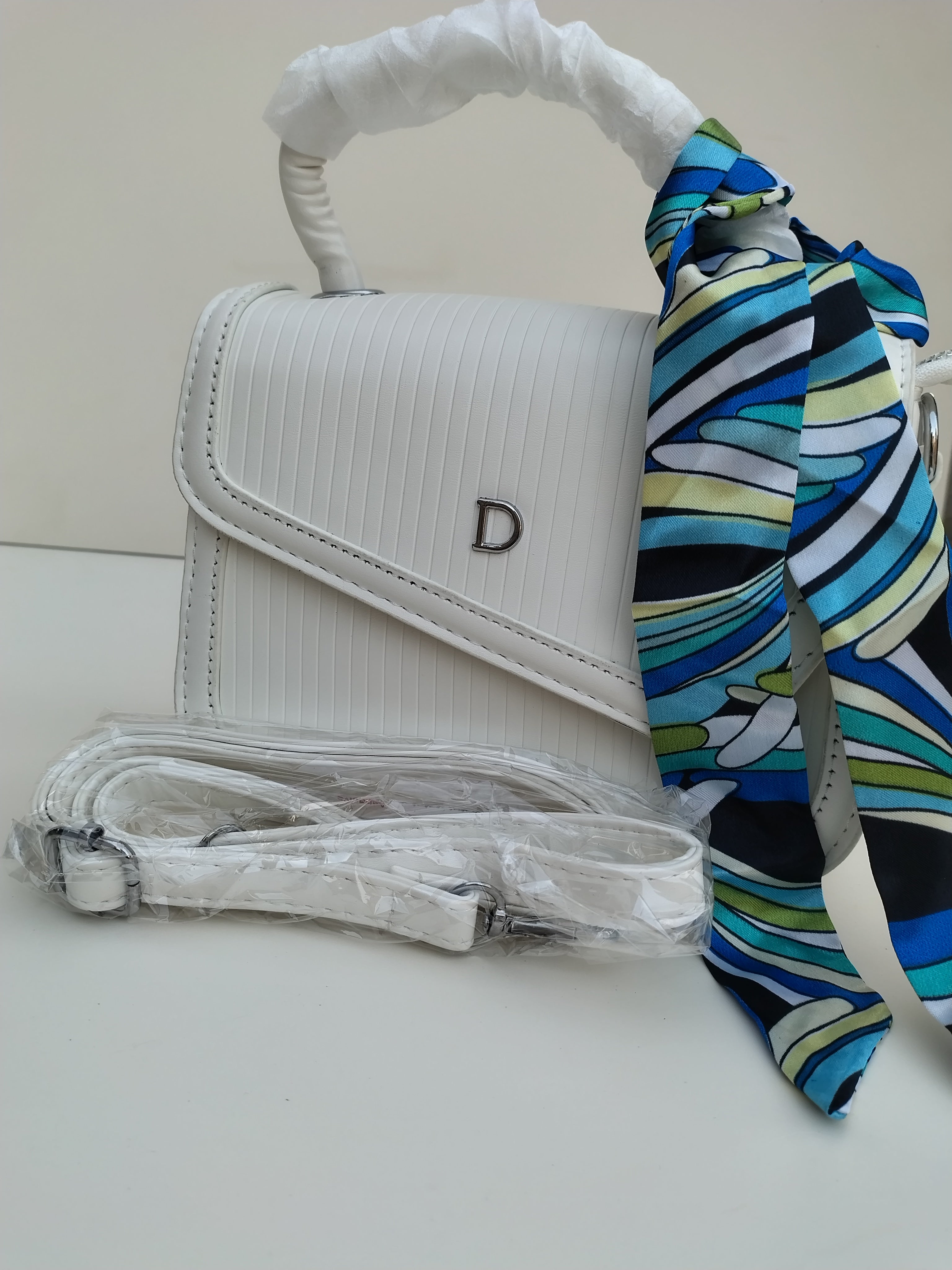 Classic White “D” Handbag – Minimalist Asymmetric Flap Design