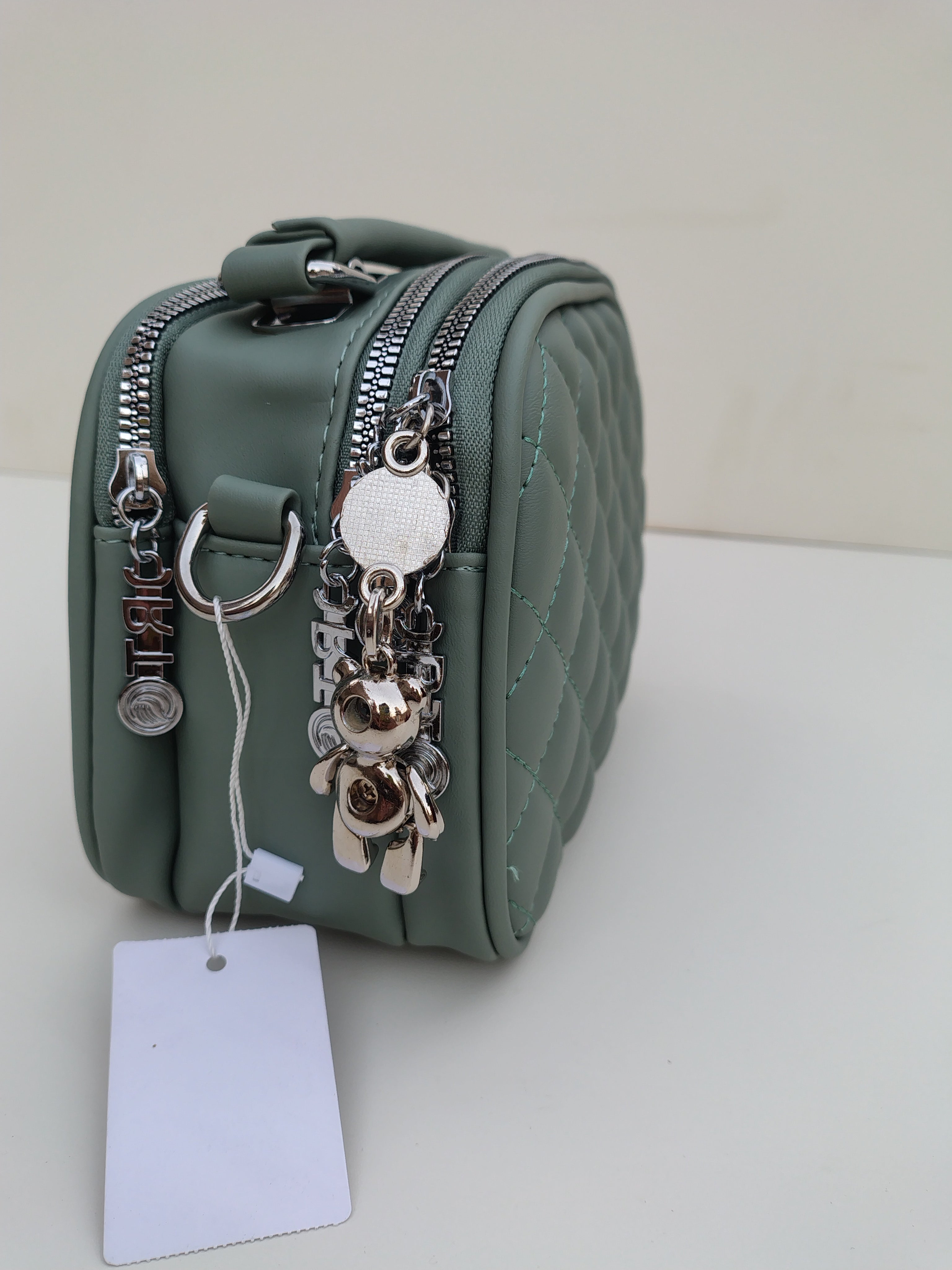 Sage Green Quilted Crossbody Bag – Charm Detail with Dual Zippers